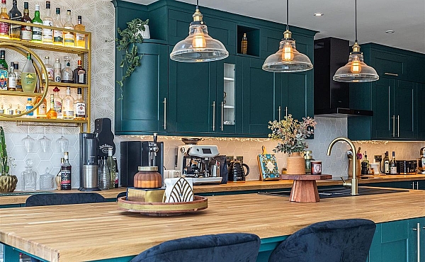 Room: Kitchen | A well-maintained kitchen and dining area featuring cabinetry, a countertop, a sink, and a chair.