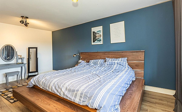 Room: Bedroom 2 | A well-presented bedroom featuring a neatly made bed with bedding, pillows, and a nightstand.