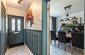 Room: Ground Floor Hallway | A well-maintained kitchen and dining area featuring a table, chairs, cabinetry, and a door.