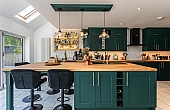 Room: Kitchen | A well-maintained kitchen featuring cabinetry, a countertop with a sink, and a chair.
