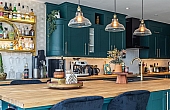 Room: Kitchen | A well-maintained kitchen and dining area featuring cabinetry, a countertop, a sink, and a chair.