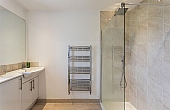 Room: Bathroom 2 | A clean, well-maintained bathroom featuring a bathtub, sink with tap, tiled walls and floor, and various bathroom accessories.